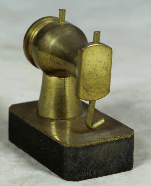 Miniature brass sewing machine
