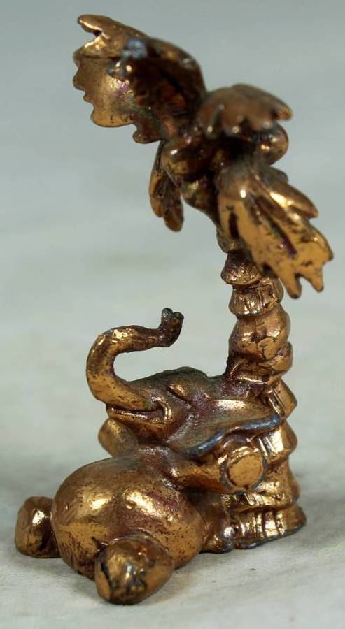 MINIATURE-BRASS COLOR LEAD ELEPHANT UNDER A PALM TREE-BID NOW!!