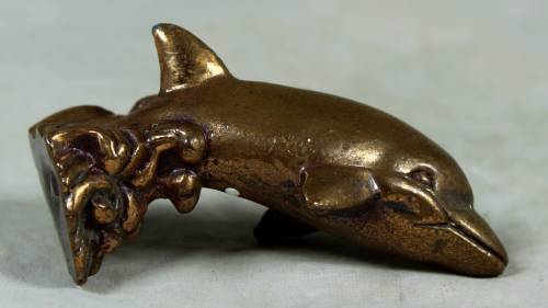 Miniature brass color lead dolphin