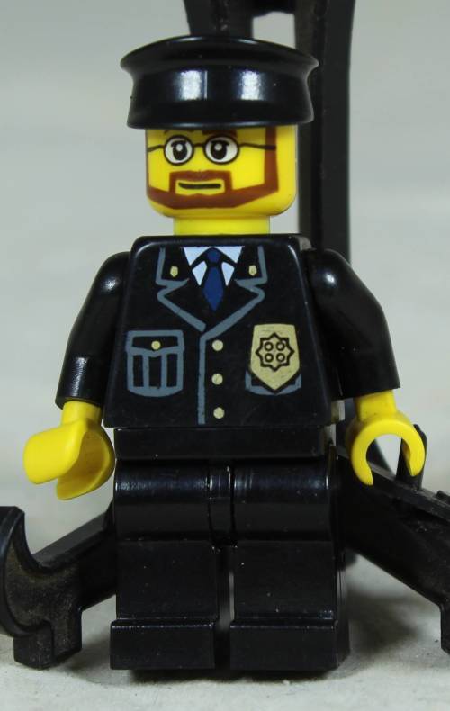 LEGO MINI FIGURINE-POLICEMAN WITH A BEARD AND A BLACK HAT BID NOW