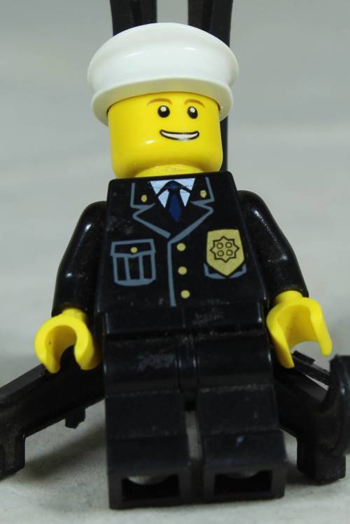Lego mini figurine - Policeman with a white hat and a smile
