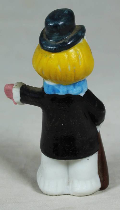 Miniature clown holding a cane