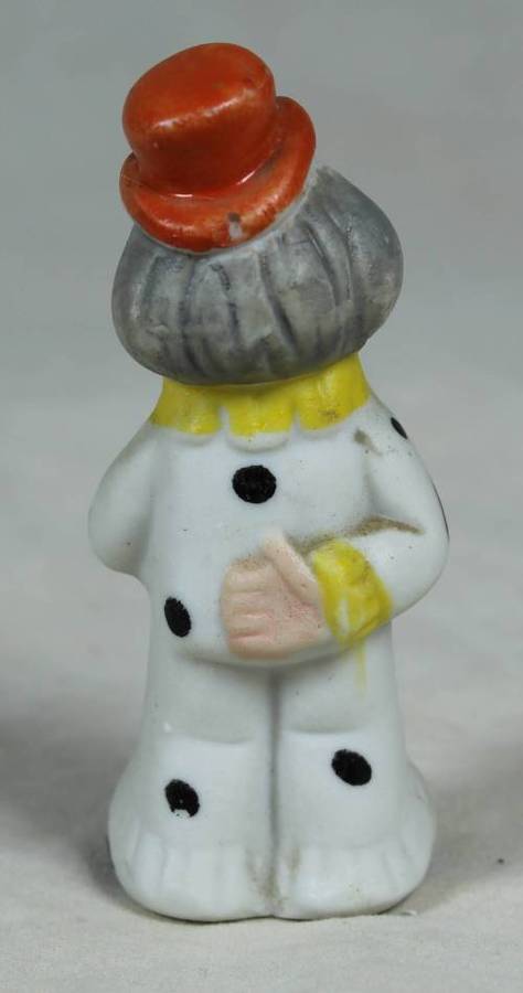 Miniature clown holding a large flower