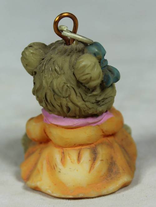 Miniature baby bear stirring a pot