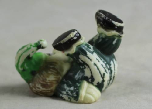 miniature clown with his feet in the air