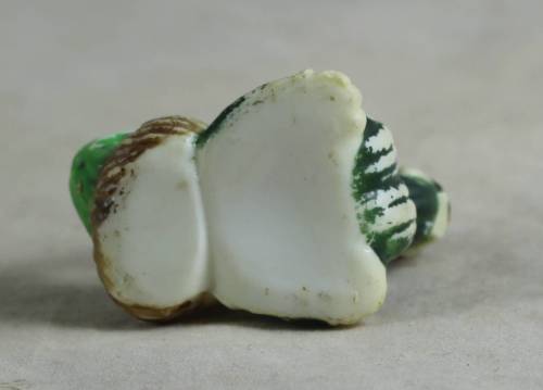 miniature clown with his feet in the air