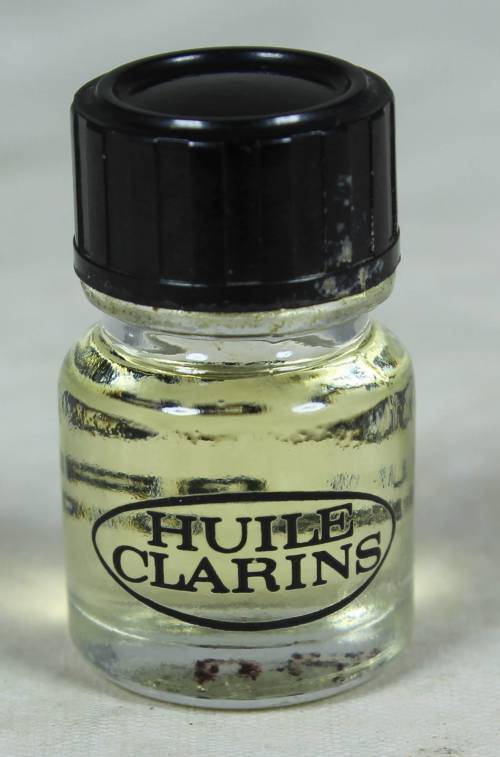 FULL MINIATURE BOTTLE OF HUILE CLARINS LOTUS PEAU GRASSE PERFUME (BEAUTIFUL) BID NOW!!