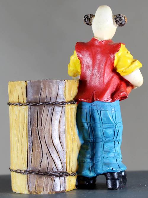 Small clown figurine with basketball and large barrel