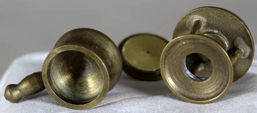 Miniature brass pot on gas burner