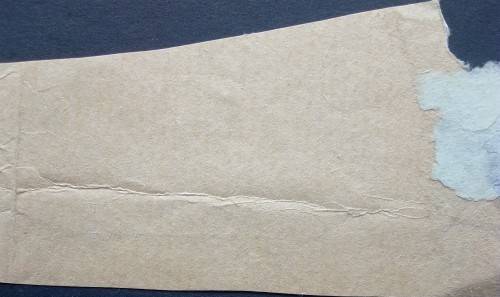 1929 Britain one pound King George V black used fixed to brown paper,creace on paper.small tear in s