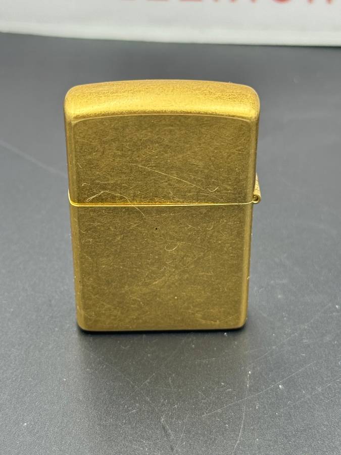 ZIPPO HOLLYWOOD'S LEADING LIGHT, A 2001 BRASS ZIPPO LIGHTER WITH APPLIED HOLLYWOOD STAR DESIGN