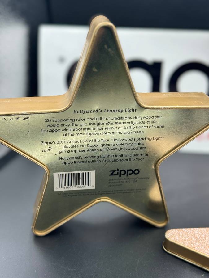 ZIPPO HOLLYWOOD'S LEADING LIGHT, A 2001 BRASS ZIPPO LIGHTER WITH APPLIED HOLLYWOOD STAR DESIGN