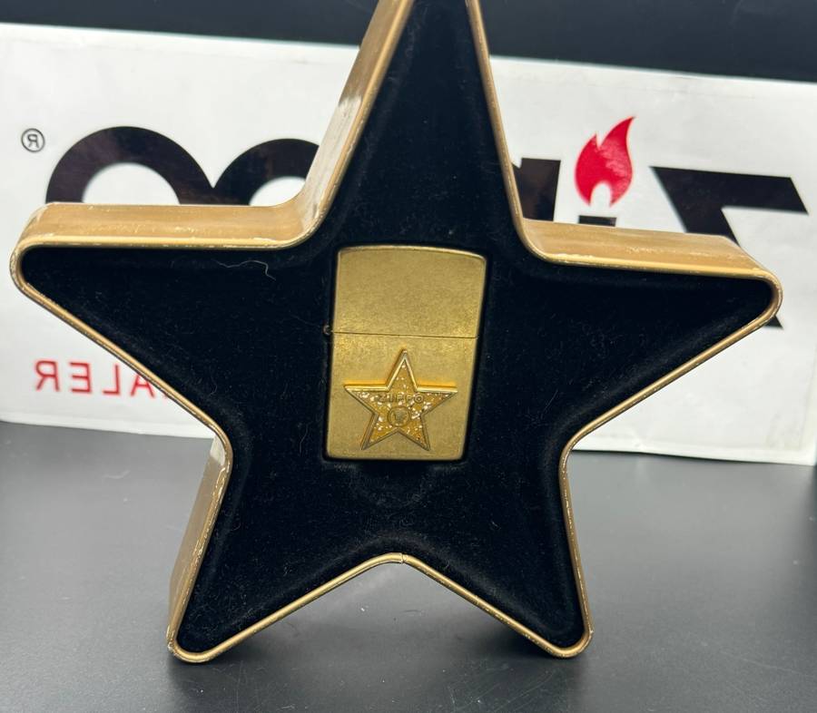 ZIPPO HOLLYWOOD'S LEADING LIGHT, A 2001 BRASS ZIPPO LIGHTER WITH APPLIED HOLLYWOOD STAR DESIGN