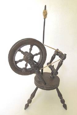 Vintage wooden model of a spinning wheel