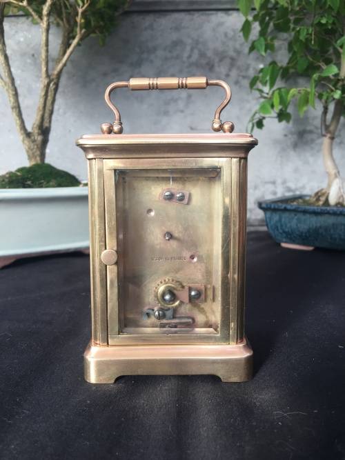 WOW !!!! CLASSIC BRASS FRENCH CARRIAGE CLOCK STAMPED "MADE IN FRANCE" WITH A PORCELAIN FACE