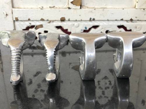WOW !!! GORGEOUS SET OF FOUR CAST ALUMINIUM ELEPHANT SHAPED SERVIETTE RINGS