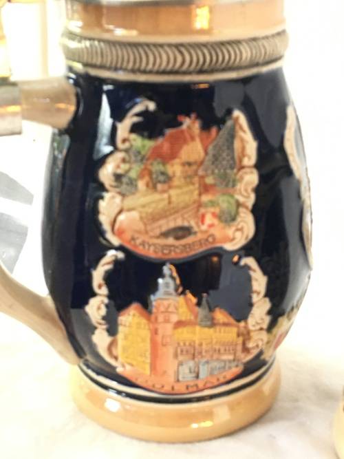 Set of 2 Graduating German Pottery Beer Steins Complete with pewter Lids.