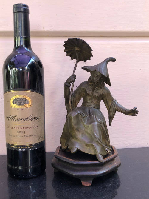 Amazing heavy cast bronze Chinese figurine on a wooden base