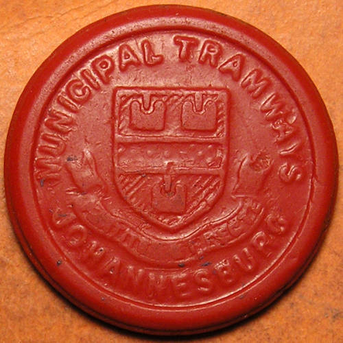 Two (x2) Johannesburg Municipal Tramways 1 1/2d Tokens * RED RARE * and a Black One.