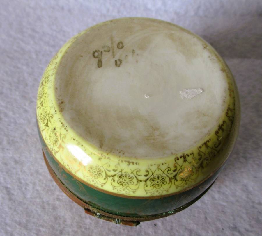 German Porcelain Round Trinket Box with hand painted gilt, brass hinge and rim. Pastoral Scene.