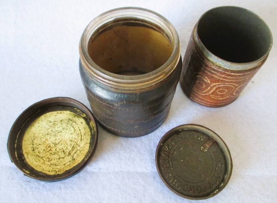 Prisoner of war trench art leather covered cigarette tins. 100mm and 85mm high. Very collectable