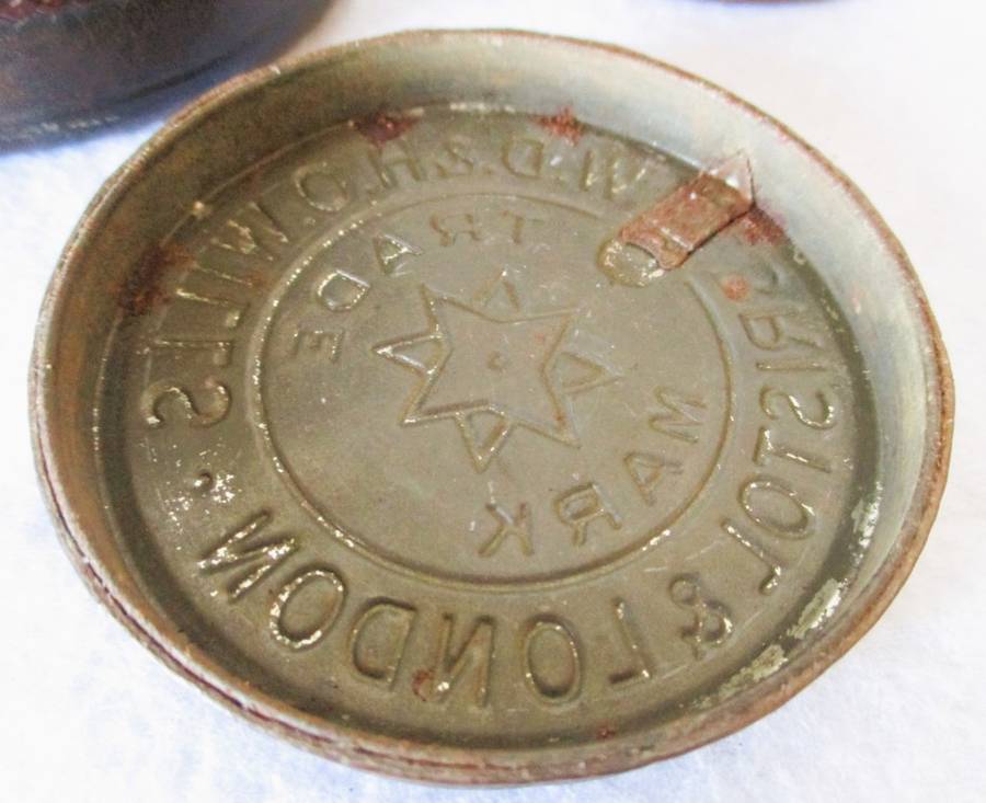 Prisoner of war trench art leather covered cigarette tins. 100mm and 85mm high. Very collectable