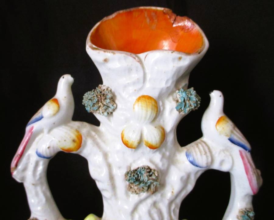 A Victorian Staffordshire spill, a cow and horse drinking from a trough beneath birds. Chip. 25x16cm