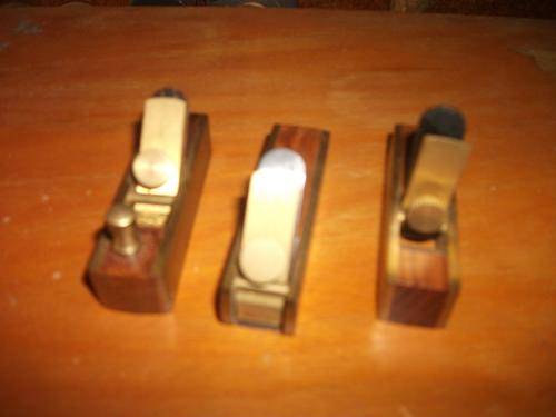 three mini brass and rosewood planes