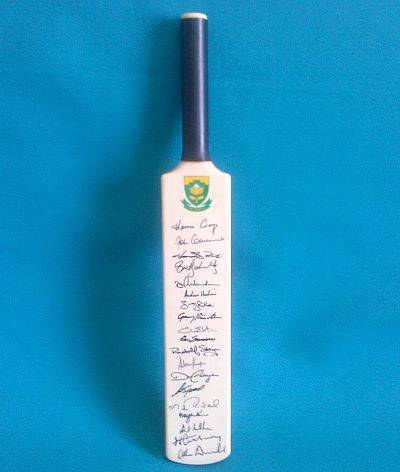 S.A. MINIATURE CRICKET BAT WITH 19 SIGNATURES (HANSIE CRONJE ETC.)