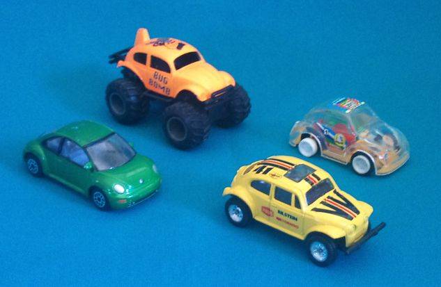 4 ASSORTED VW BEETLE MATCHBOX SIZE CARS