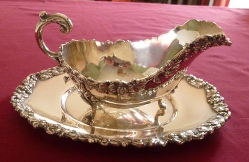 Dramatic silver plated sauce boat on stand