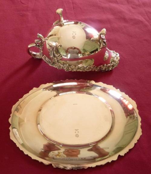 Dramatic silver plated sauce boat on stand