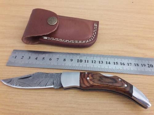 Handmade Damascus steel folding knife with Wooden handle scales.