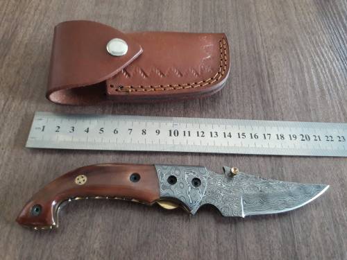 Handmade Damascus steel folding knife with Camel Bone handle scales.