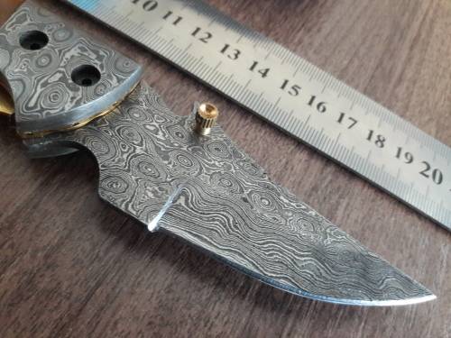 Handmade Damascus steel folding knife with Camel Bone handle scales.