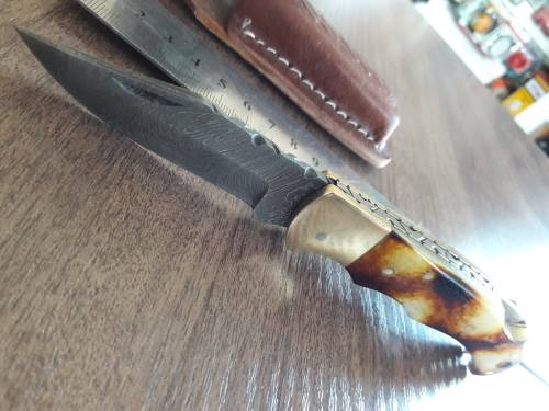 Handmade Damascus steel folding knife with Burnt Camel Bone handle scales.