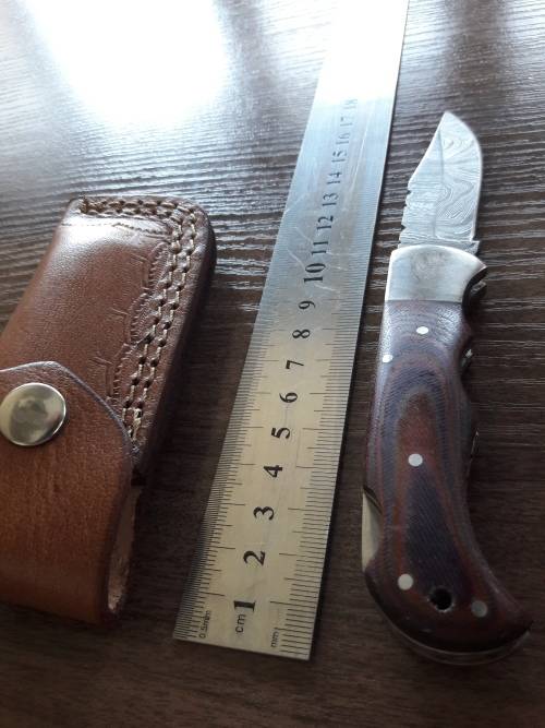 Handmade Damascus steel folding knife with MICARTA handle scales. THIS AUCTION will only ship 28th
