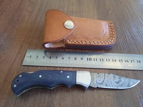 Handmade Damascus steel folding knife with MICARTA handle scales.