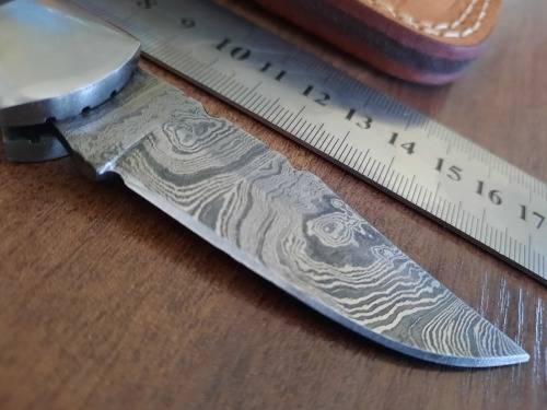 Handmade Damascus steel folding knife with MICARTA handle scales.