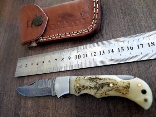 Handmade Damascus steel folding knife w Camel Bone Handle Scales. Art engraved.