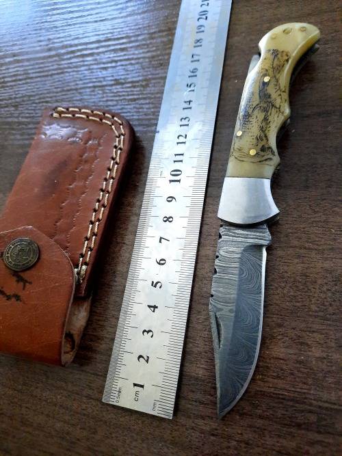 Handmade Damascus steel folding knife w Camel Bone Handle Scales. Art engraved.