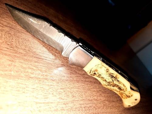Handmade Damascus steel folding knife w Camel Bone Handle Scales. Art engraved.