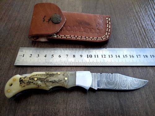 Handmade Damascus steel folding knife w Camel Bone Handle Scales. Art engraved.