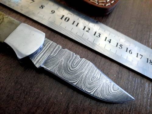 Handmade Damascus steel folding knife w Camel Bone Handle Scales. Art engraved.