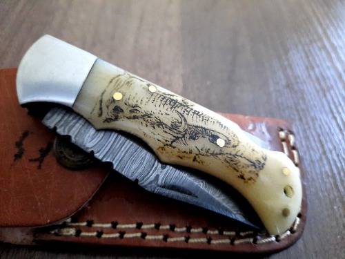Handmade Damascus steel folding knife w Camel Bone Handle Scales. Art engraved.