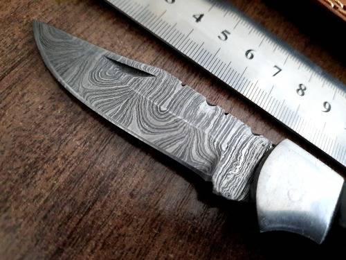 Handmade Damascus steel folding knife with Bull Horn Handle. Tiger picture engraved.