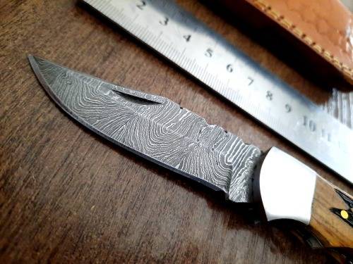 Handmade Damascus steel folding knife with wooden handle scales. Picture engraved. NEW STOCK !