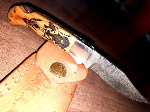 Handmade Damascus steel folding knife with wooden handle scales. Picture engraved. NEW STOCK !