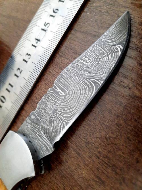 Handmade Damascus steel folding knife with wooden handle scales. Picture engraved. NEW STOCK !