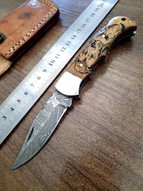 Handmade Damascus steel folding knife w Wooden Handle Scales. New stock !! LEATHER Pouch is BAD.